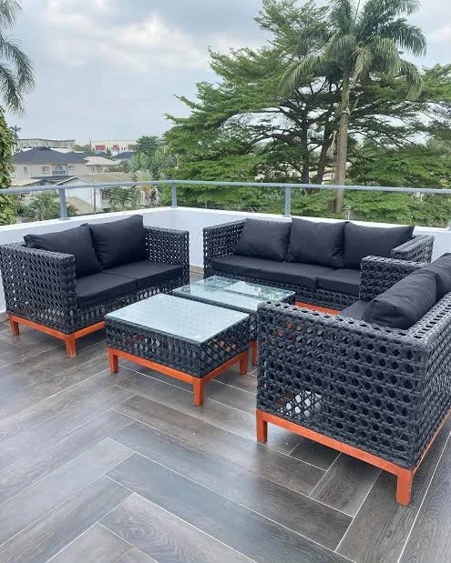 Living room furnished with a fabric sofa and timber side tables